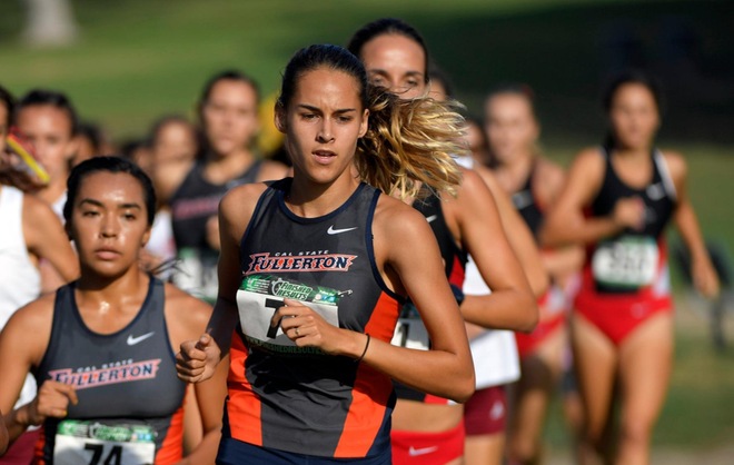Sam Huerta running with the back behind her.
