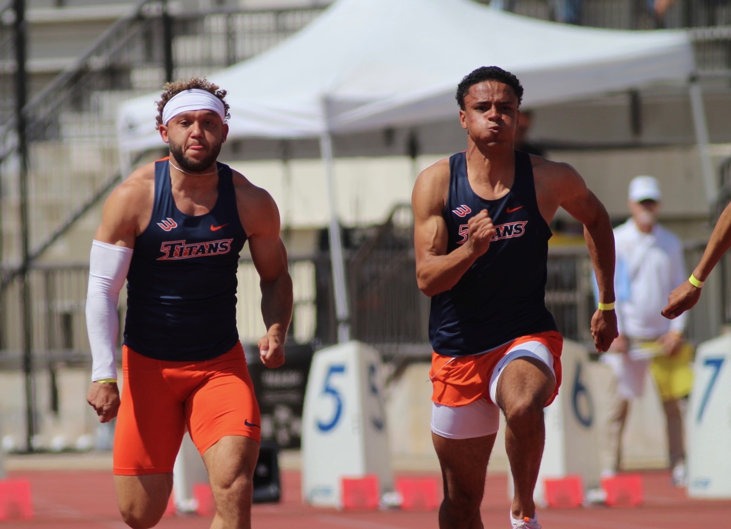 Cooper Bibbs(left), Alonzo Floriolli(right) running the 100m dash