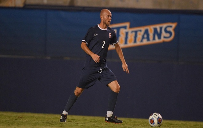 Peek's Late Goal Springs Titans to Victory