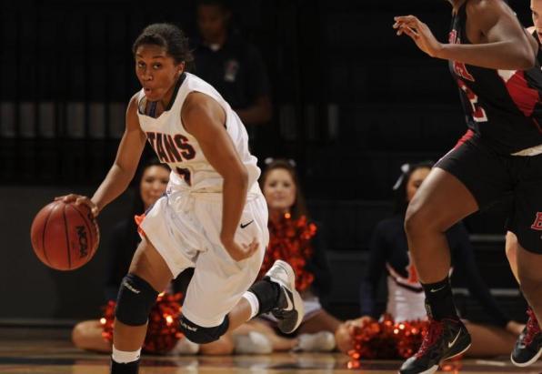 Chante Miles dribbles the ball